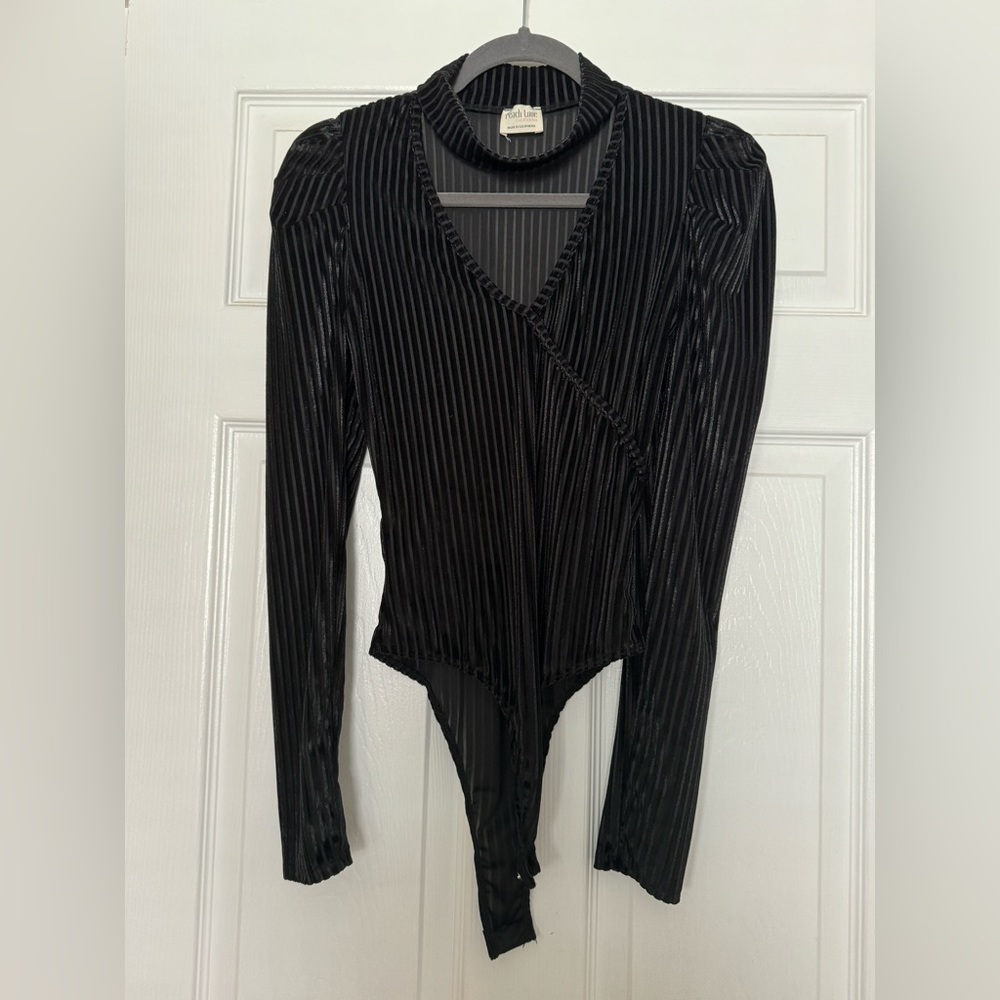 These three boutique black bodysuit